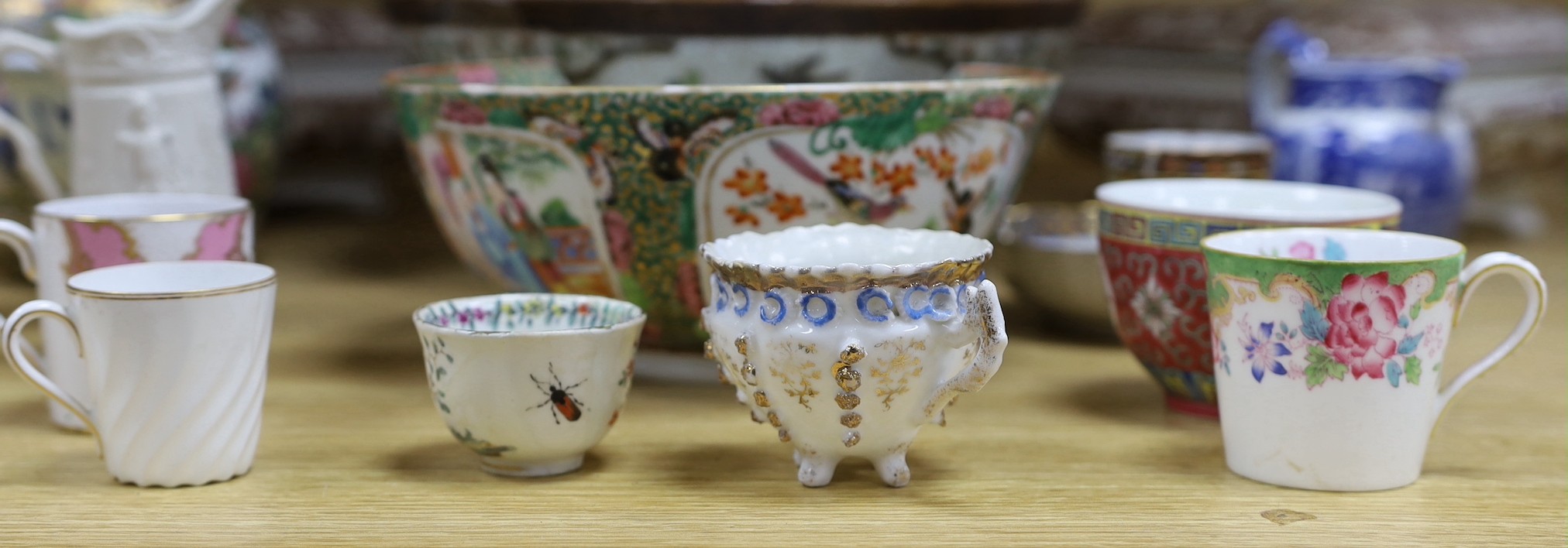 A group of mixed ceramics and an enamel brush